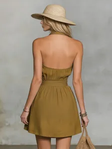 Back view of a stylish khaki halter neck dress with waist tie for summer resort style