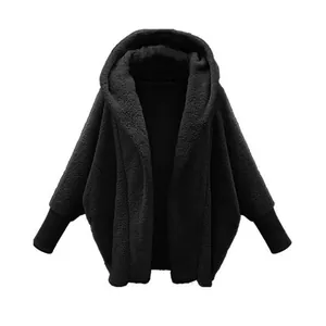 Detailed view of women's black oversized hooded fleece jacket with soft texture