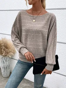 Close-up detail showing the textured fabric of this women's beige long sleeve knit top.