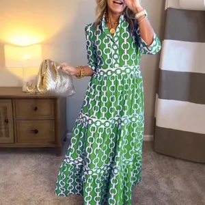 Elegant green and white geometric print maxi dress for spring and summer
