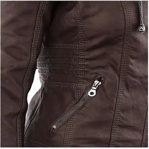 Close-up detail of a dark brown faux leather jacket featuring zipper and stitching texture.