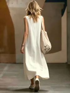 Elegant back view of a minimalist white sleeveless maxi dress for women in summer