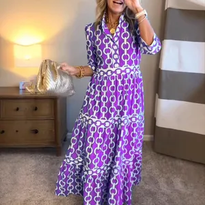 Stylish geometric chain link print maxi dress with long sleeves in vibrant purple and white