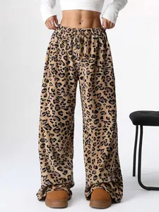 Full length view of stylish leopard print wide-leg trousers for a trendy feminine look
