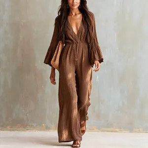 Bohemian style brown V-neck long sleeve jumpsuit with elastic waist and wide leg fit