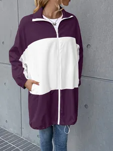 Detailed view of the purple and white color-block waterproof jacket with zipper and pockets