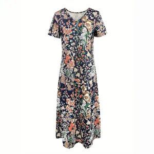 Detail showing the vintage floral print and classic V-neckline of this summer dress.