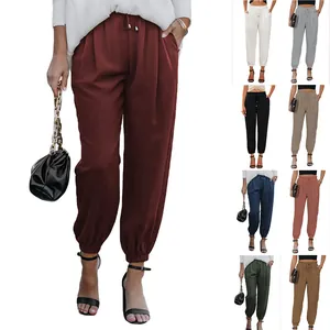 Detail of high-waisted drawstring joggers with elastic cuffs in multiple colors