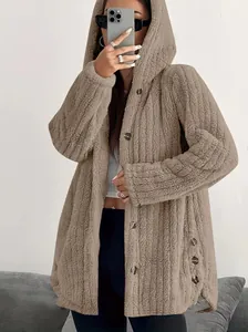 Detailed view of cozy tan plush hooded jacket featuring side button details on a model