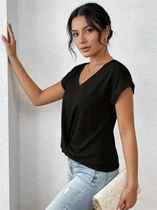 Close-up of elegant black V-neck short sleeve T-shirt with chic waist twist detail on model