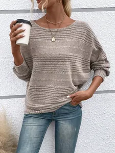 Close-up of beige textured knit long-sleeve pullover with horizontal ribbing