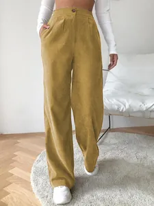 Detail shot of high-waisted mustard yellow corduroy wide-leg pants for women