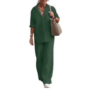 Casual women's green two-piece set with a long-sleeve lapel shirt and wide-leg pants.