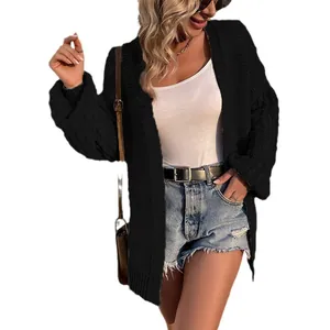 Fashionable women's black chunky knit cardigan with lantern sleeves in oversized style