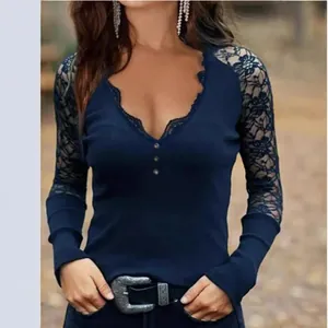 Elegant navy blue V-neck top with intricate floral lace sleeves for professional women.