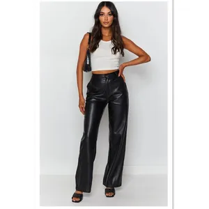 Stylish high-waisted black PU leather trousers for women in a chic minimalist outfit