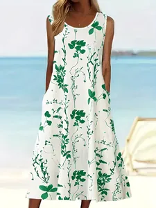 Ärmelloses weißes Maxikleid mit grünem Blumendruck und Seitentaschen für den Strandurlaub