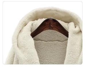 Close-up detail of white plush hooded jacket showing soft fleece lining and texture
