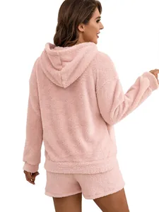 Detailed back view of a soft pink fuzzy hooded sweatshirt and shorts two-piece lounge set