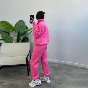 Back view of a stylish pink fleece tracksuit set with zip-up hoodie and joggers