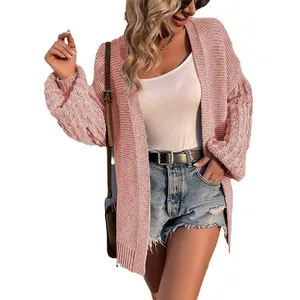 Chunky pink knit cardigan with stylish lantern sleeves and textured cable pattern