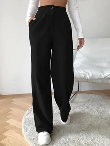 Stylish women's high waisted black corduroy wide leg trousers for a casual autumn look