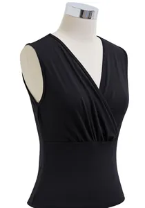 Close-up detail of a black slim fit cross V-neck pleated sleeveless tank top for women