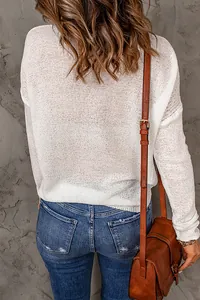 Detailed back view of a stylish white semi-sheer long-sleeve knit sweater for women