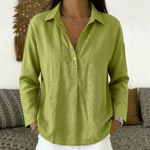 Detail of lime green loose linen-blend shirt with lapel collar and buttoned V-neckline.