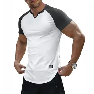Close-up of a slim fit white and black raglan t-shirt with a unique v-neck cutout design