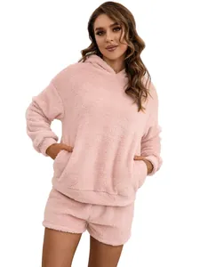Soft pink fuzzy hooded sweatshirt and shorts loungewear set for women, cozy winter style.