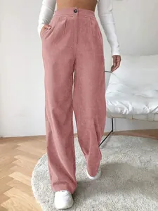 Detail shot of pink high-waisted corduroy pants showing the loose straight leg fit.