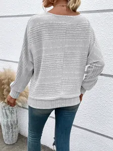 Back view of a casual grey long-sleeved ribbed knit top featuring seam detail design