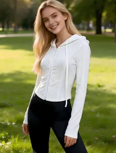 Close-up view of a white ribbed zip-up hooded sweatshirt featuring a slim fit sporty design