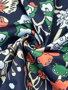 Close-up of whimsical mushroom print on a soft v-neck dress fabric for women.