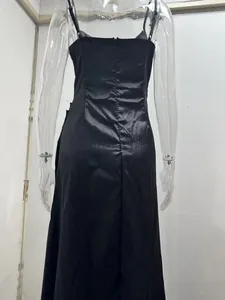 Detailed back view of an elegant black satin slip dress with smooth silk-like finish