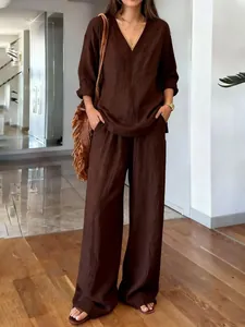 Elegant brown washed cotton two-piece set featuring V-neck long sleeve top and wide pants