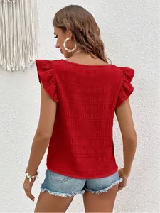 Detailed back view of a red smocked blouse featuring ruffle sleeves and a square neckline.