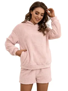 Detail showing the full fit and texture of the pink sherpa fleece hoodie and shorts set