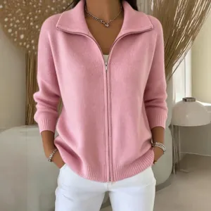 Detail shot of a modern pink knit zip-up cardigan with a ribbed collar for women