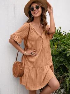 Stylish bohemian orange tiered V-neck dress with ruffled sleeves for a summer vacation look
