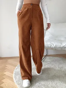 Detail view of brown high-waisted corduroy wide-leg trousers for a casual look