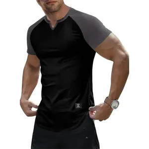 Close-up of men's slim fit raglan t-shirt with ribbed texture and grey sleeves.