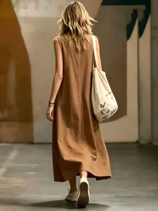 Macro view of brown sleeveless maxi dress with a minimalist back silhouette design