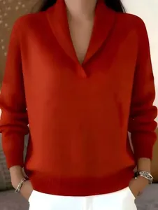 Close-up of vibrant orange V-neck long sleeve knit sweater with elegant shawl collar