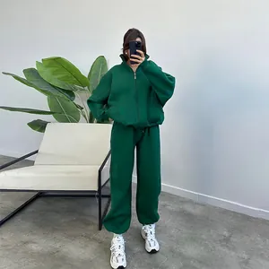 Stylish dark green fleece-lined oversized zip-up sweatshirt and joggers tracksuit set