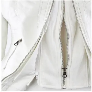 High-quality close-up showing double-zipper detail and texture on white faux leather jacket