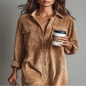 Detailed view of a brown corduroy long-sleeve button-down shirt dress with pockets