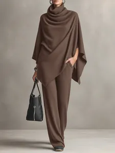 Elegant brown two-piece set featuring cowl neck poncho top and matching wide leg pants