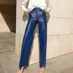 Detail shot of stylish blue high-waisted wide-leg PU leather trousers for women.